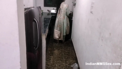 Masked Indian woman approached in the kitchen